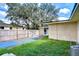 Backyard with concrete patio and wooden fence at 33137 Cercelia Rd, Dade City, FL 33523
