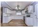 Updated kitchen with white cabinets and granite countertops at 33137 Cercelia Rd, Dade City, FL 33523