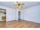 Bright bedroom with wood floors, ceiling fan and walk-in closet at 33137 Cercelia Rd, Dade City, FL 33523