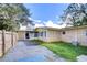 Home with a large backyard and wooden fence at 33137 Cercelia Rd, Dade City, FL 33523