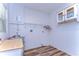 Laundry room with wood countertop, shelving and vinyl flooring at 33137 Cercelia Rd, Dade City, FL 33523