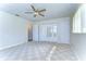 Bedroom with carpet, ceiling fan and mirrored closet doors at 33137 Cercelia Rd, Dade City, FL 33523