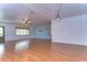 Living room with wood floors and a ceiling fan at 33137 Cercelia Rd, Dade City, FL 33523
