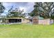 House with spacious backyard, shed, and green grass at 33137 Cercelia Rd, Dade City, FL 33523