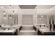 Luxurious bathroom with double vanity, soaking tub, and modern lighting at 4441 Pompano Se Dr, St Petersburg, FL 33705