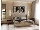 Spacious bedroom with large bed, nightstands, and artistic wall decor at 4441 Pompano Se Dr, St Petersburg, FL 33705