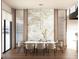 Elegant dining room features a modern chandelier, marble accent wall, and water views from large windows at 4441 Pompano Se Dr, St Petersburg, FL 33705
