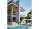 Stunning home exterior with stone accents and a beautiful pool at 4441 Pompano Se Dr, St Petersburg, FL 33705