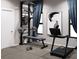 Home gym with a treadmill, weight bench and wall-mounted equipment at 4441 Pompano Se Dr, St Petersburg, FL 33705