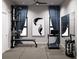 Well-equipped home gym with treadmill, weights, and wall-mounted equipment at 4441 Pompano Se Dr, St Petersburg, FL 33705
