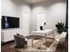 Home office with a sleek white desk, comfortable chair, and ample workspace at 4441 Pompano Se Dr, St Petersburg, FL 33705