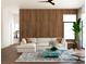 Living area with wood wall and comfortable seating at 4441 Pompano Se Dr, St Petersburg, FL 33705
