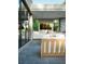 Modern outdoor kitchen with built-in appliances and comfortable seating area at 4441 Pompano Se Dr, St Petersburg, FL 33705