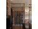 Modern wine cellar with glass-front storage and sleek cabinetry at 4441 Pompano Se Dr, St Petersburg, FL 33705