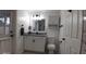 Bright bathroom with granite countertop, updated vanity, and new toilet at 4614 Webster St, Tampa, FL 33610
