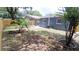 Landscaped backyard with a wooden fence at 4614 Webster St, Tampa, FL 33610