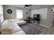 Bright living room with white couch and gray rug at 4614 Webster St, Tampa, FL 33610