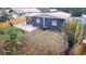 Well-maintained backyard featuring a lawn, wooden fence, and screened-in porch at 4614 Webster St, Tampa, FL 33610