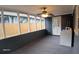 Spacious screened porch with ceiling fan, perfect for relaxing at 4614 Webster St, Tampa, FL 33610