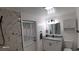Updated bathroom features a walk-in shower, modern vanity, and stylish fixtures at 4614 Webster St, Tampa, FL 33610