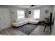 Living area with off-white sectional sofa and wood floors at 4614 Webster St, Tampa, FL 33610