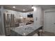 Modern kitchen with white cabinets and granite countertops at 4614 Webster St, Tampa, FL 33610