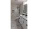 Spa-like bathroom with marble shower and double vanity at 4614 Webster St, Tampa, FL 33610