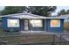 Newly painted blue house with a chain-link fence at 4614 Webster St, Tampa, FL 33610