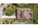 Top-down view of house, pool and surrounding landscape at 10200 Shooting Star Ct, New Port Richey, FL 34655