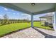 View from back patio, showcasing the serene backyard and landscaping at 10316 Cross River Trl, Parrish, FL 34219
