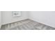 Bright bedroom with plush carpeting, white walls, and a window allowing natural light at 10316 Cross River Trl, Parrish, FL 34219