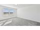Bright bedroom with natural light, large windows, and neutral colored carpet at 10316 Cross River Trl, Parrish, FL 34219
