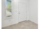 Bright foyer with a white door, tile flooring and a window offering natural light at 10316 Cross River Trl, Parrish, FL 34219