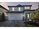 Charming two-story home with a paved driveway and manicured landscaping at 10316 Cross River Trl, Parrish, FL 34219