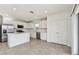 Modern kitchen featuring white cabinets, stainless steel appliances, and tile flooring at 10316 Cross River Trl, Parrish, FL 34219