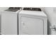 Modern, white Whirlpool washing machine and dryer in a laundry room at 10316 Cross River Trl, Parrish, FL 34219