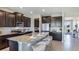 Modern kitchen with a large island, stainless steel appliances, and granite countertops at 10437 Farm Hill Ave, Land O Lakes, FL 34638