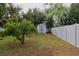 Backyard with shed and lush landscaping at 12408 Noreast Lake Dr, Tampa, FL 33612