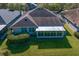 Aerial view showcasing home's backyard and sunroom at 16183 Colchester Palms Dr, Tampa, FL 33647