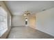 Light and airy living room with tile flooring and ceiling fan at 18138 Lake Worth Blvd, Port Charlotte, FL 33948