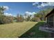 Expansive grassy backyard offering privacy and tranquility at 18138 Lake Worth Blvd, Port Charlotte, FL 33948