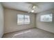 Spacious bedroom with ceiling fan and large windows at 18138 Lake Worth Blvd, Port Charlotte, FL 33948