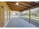 Covered patio with screened enclosure and backyard access at 18138 Lake Worth Blvd, Port Charlotte, FL 33948