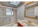 Well-lit bathroom with a tub/shower combo and vanity at 18138 Lake Worth Blvd, Port Charlotte, FL 33948