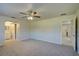 Bedroom with ceiling fan and access to bathroom and hallway at 18138 Lake Worth Blvd, Port Charlotte, FL 33948
