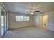 Bedroom with ceiling fan and view of backyard at 18138 Lake Worth Blvd, Port Charlotte, FL 33948