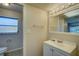 Simple bathroom with vanity, mirror and toilet at 18138 Lake Worth Blvd, Port Charlotte, FL 33948