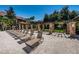 Relaxing pool deck with lounge chairs and a pergola at 2500 Winding Creek Blvd # E102, Clearwater, FL 33761