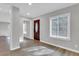 Bright entryway with hardwood floors and a view into the living room at 2623 W Tyson Ave, Tampa, FL 33611