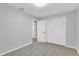 Bedroom with gray walls, carpet flooring, and a closet at 2623 W Tyson Ave, Tampa, FL 33611